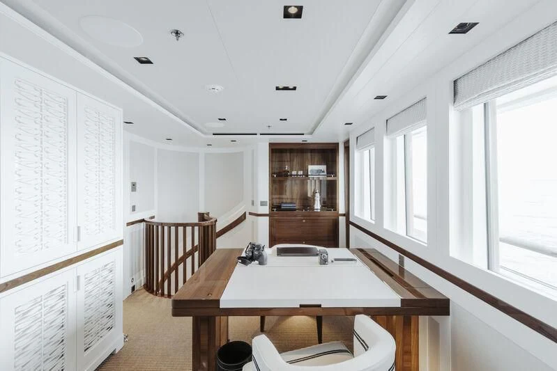 a room with a table and chairs aboard BLUE II Yacht for Charter