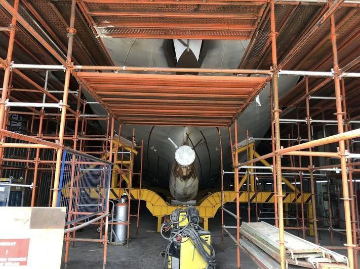 a large metal machine in a factory aboard BLUE II Yacht for Charter