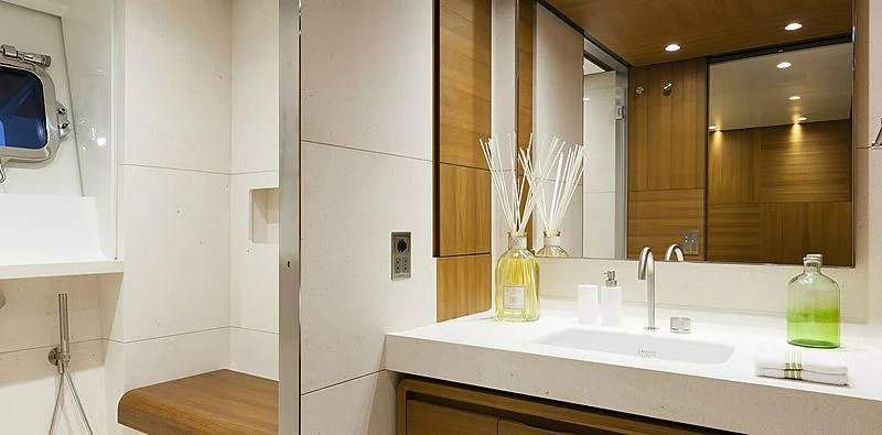 a bathroom with a sink and a mirror aboard PACHAMAMA Yacht for Sale