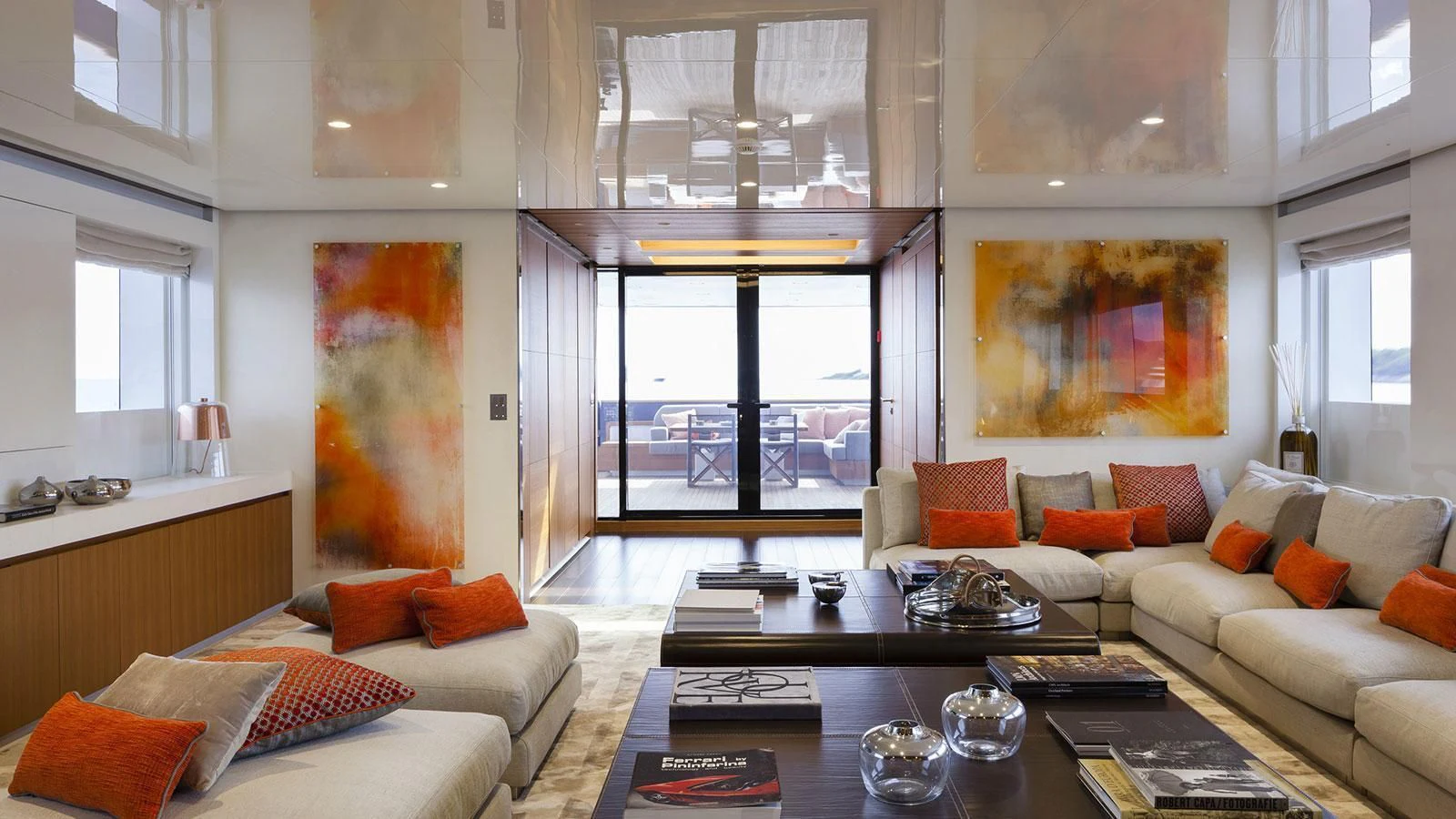 a living room with a glass coffee table and a couch aboard PACHAMAMA Yacht for Sale