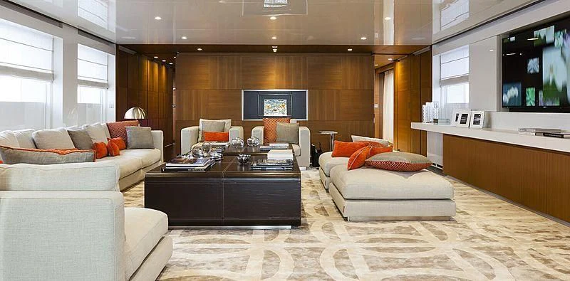 a living room with a large screen aboard PACHAMAMA Yacht for Sale