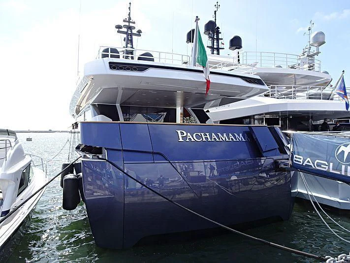 a boat docked at a pier aboard PACHAMAMA Yacht for Sale