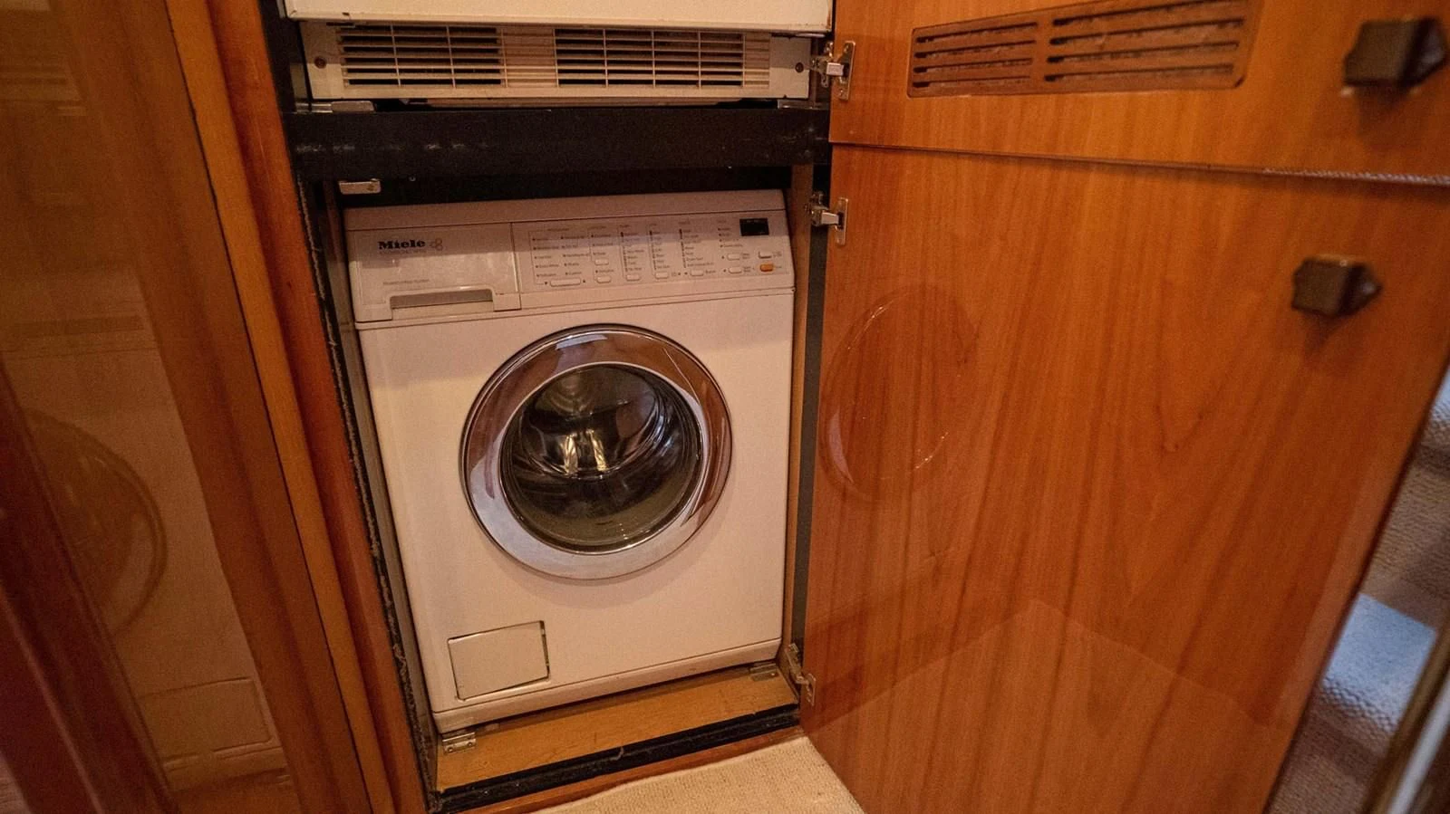 a washing machine in a room aboard HAN SOLO Yacht for Sale