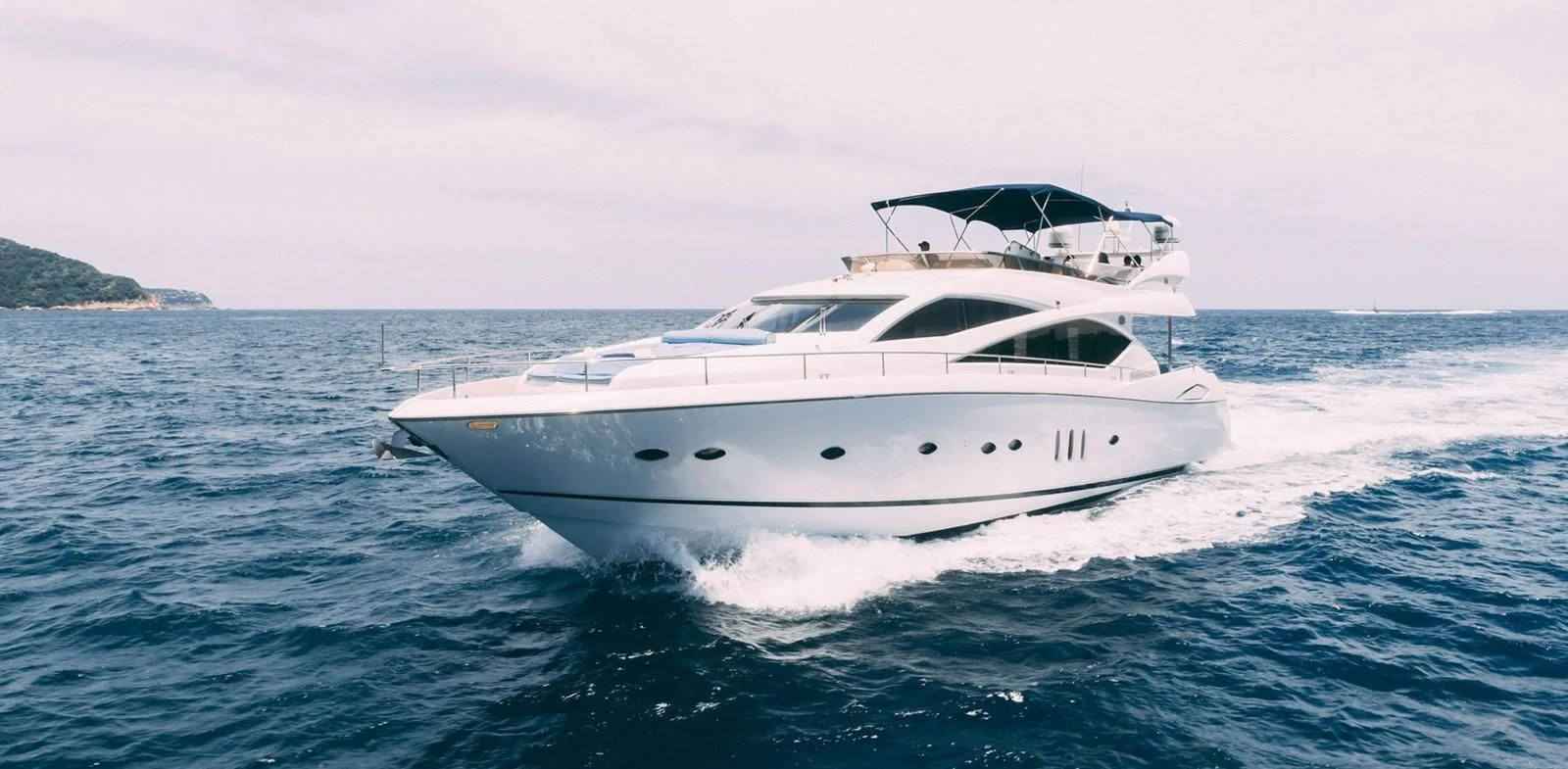 a white yacht on the water aboard HAN SOLO Yacht for Sale