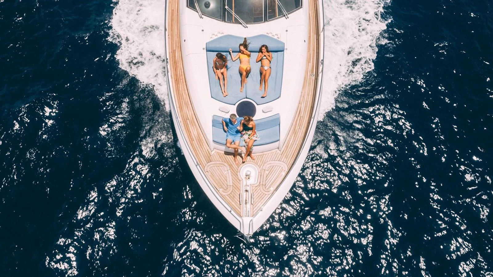 a white ship with a group of people on it aboard HAN SOLO Yacht for Sale