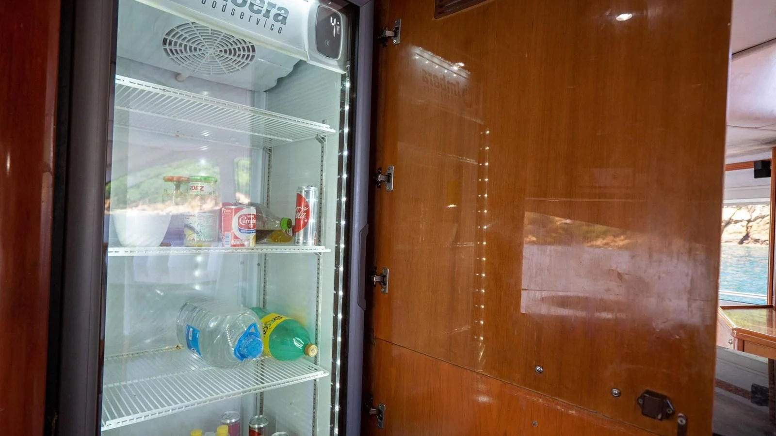 a refrigerator with a door open aboard HAN SOLO Yacht for Sale