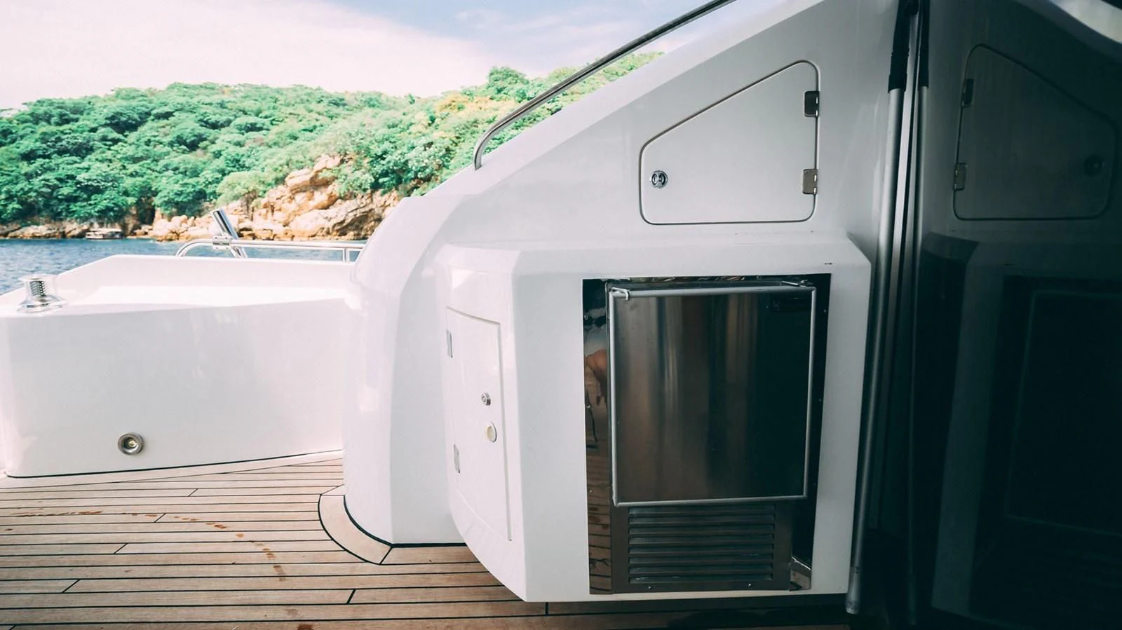 a white rectangular object with a black object on a wooden surface aboard HAN SOLO Yacht for Sale