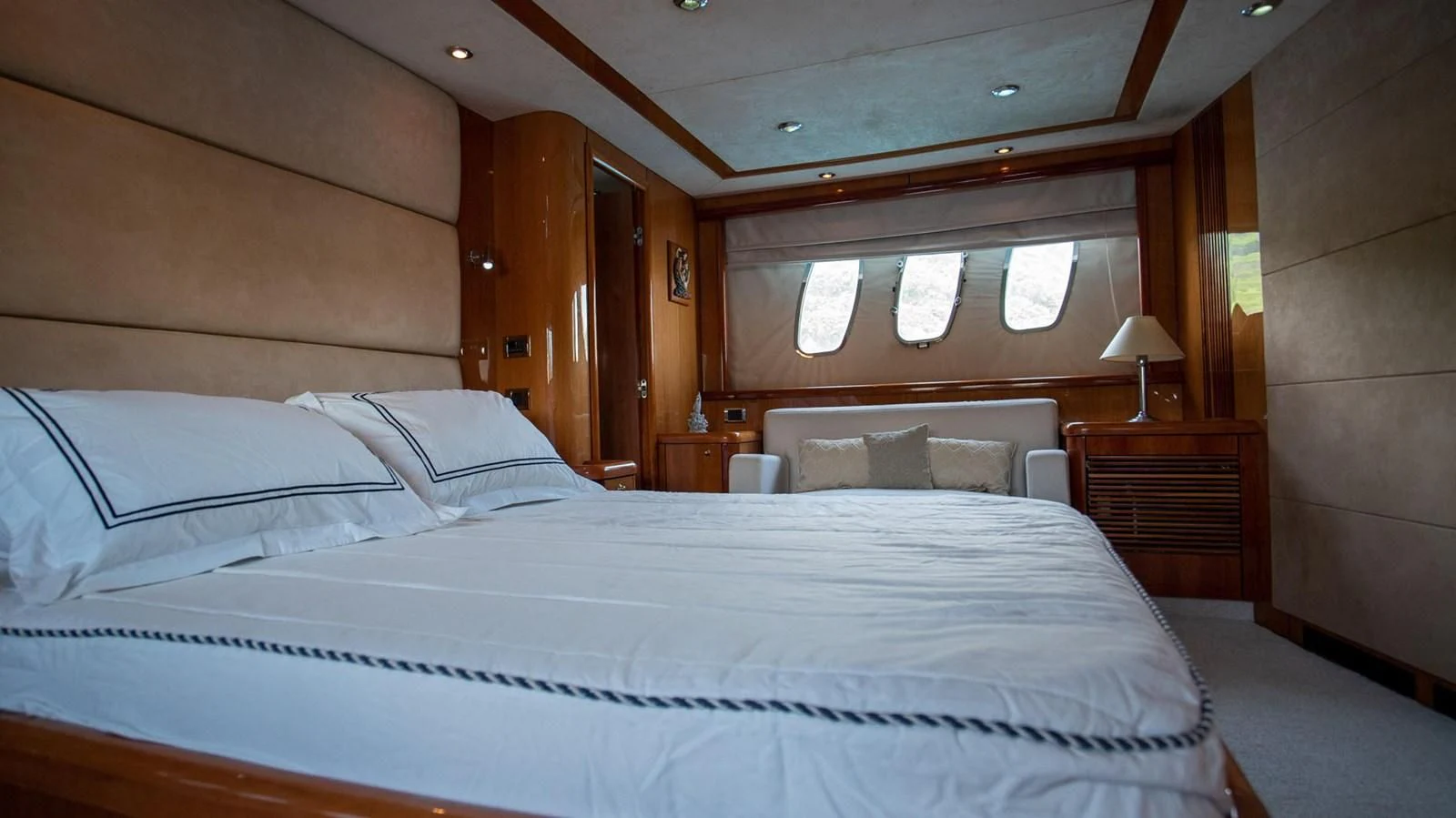 a bed with white sheets aboard HAN SOLO Yacht for Sale