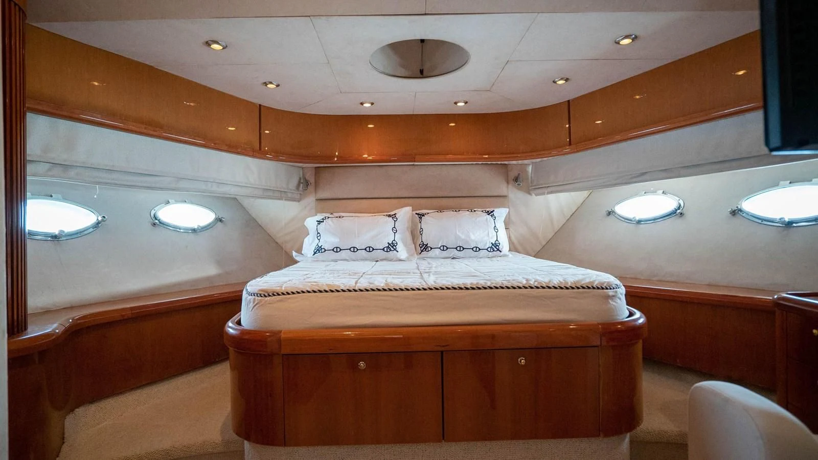 a room with a bed and a mirror aboard HAN SOLO Yacht for Sale