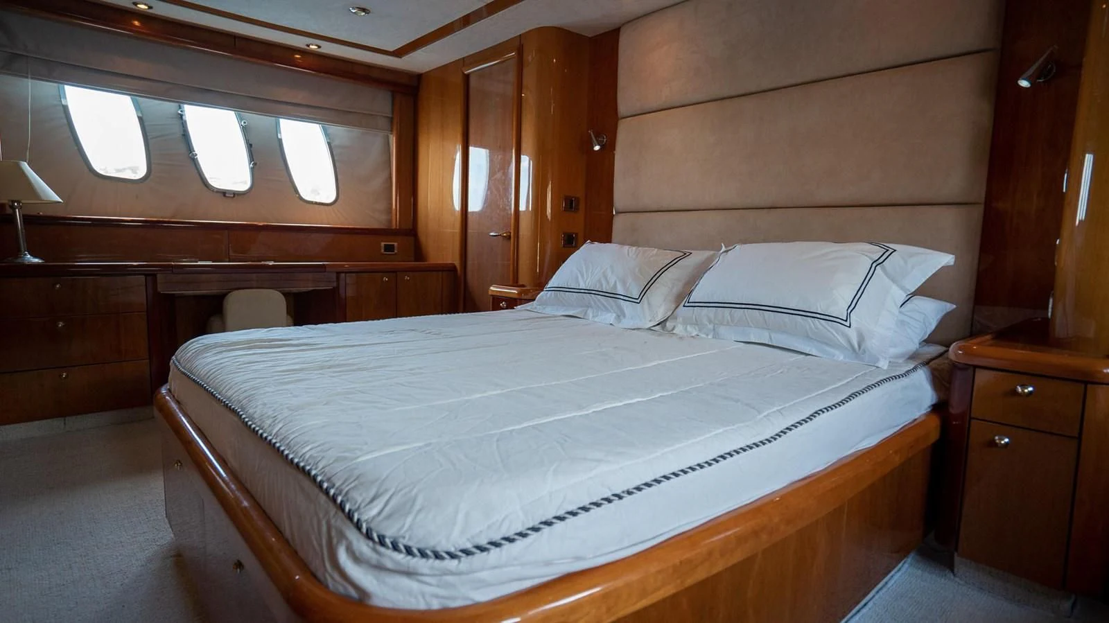 a bed with white sheets aboard HAN SOLO Yacht for Sale