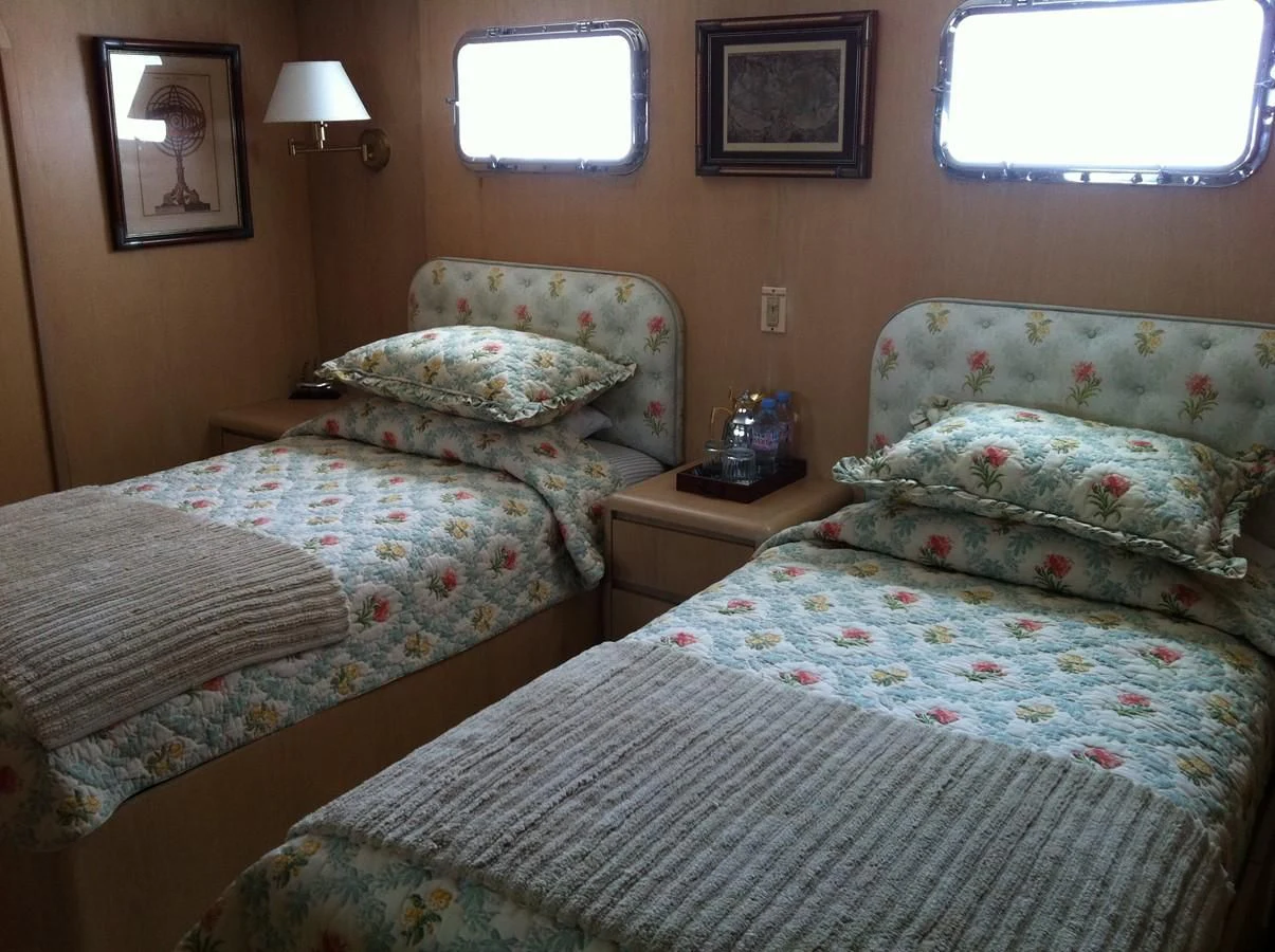 a couple of beds in a hotel room aboard ZANTINO III Yacht for Sale