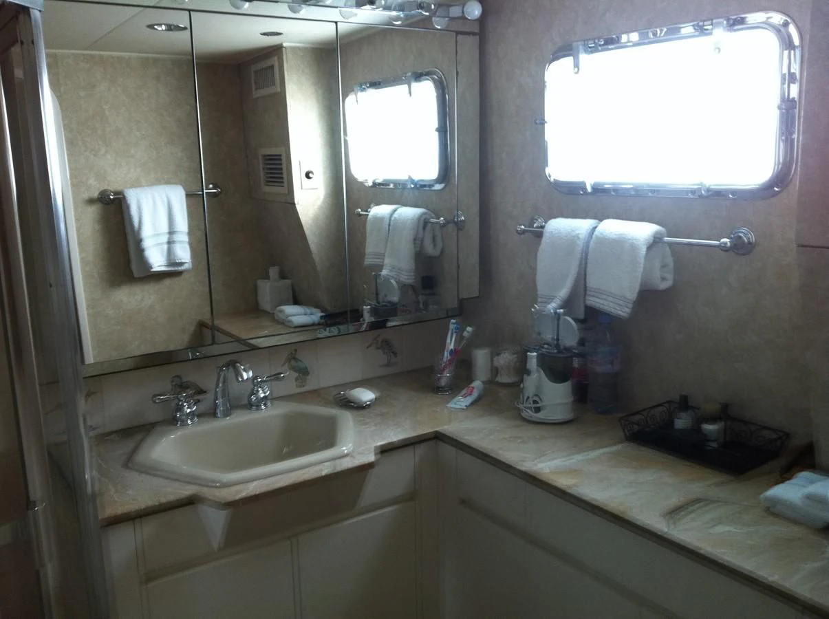 a bathroom with a large mirror aboard ZANTINO III Yacht for Sale