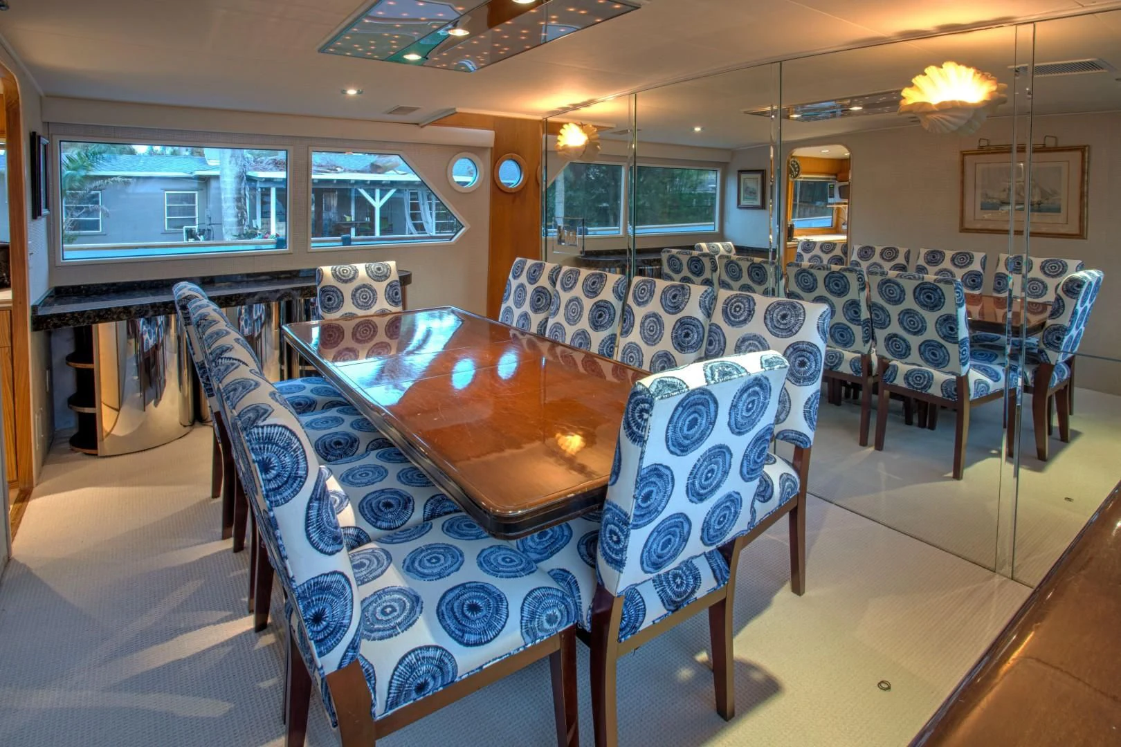 a room with a table and chairs aboard ZANTINO III Yacht for Sale