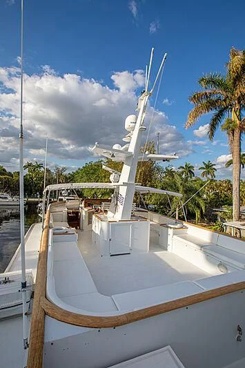 a large white structure with a spiral staircase and palm trees aboard ZANTINO III Yacht for Sale