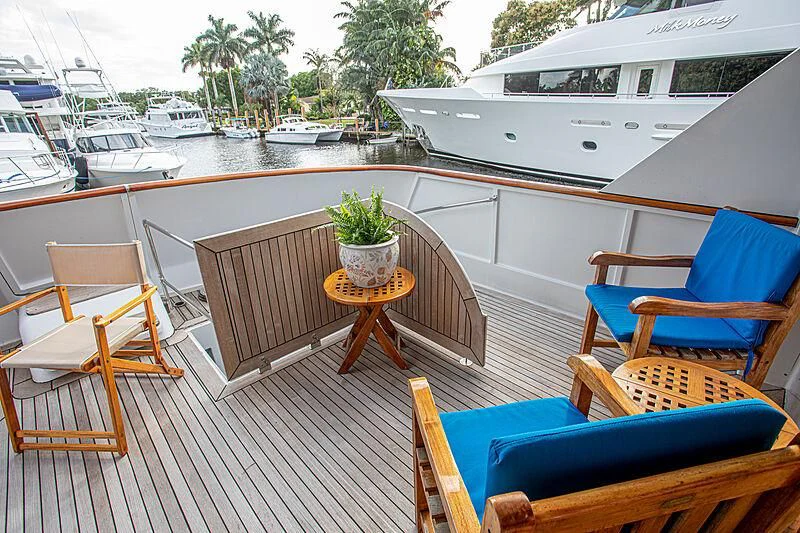 a table and chairs on a deck aboard ZANTINO III Yacht for Sale
