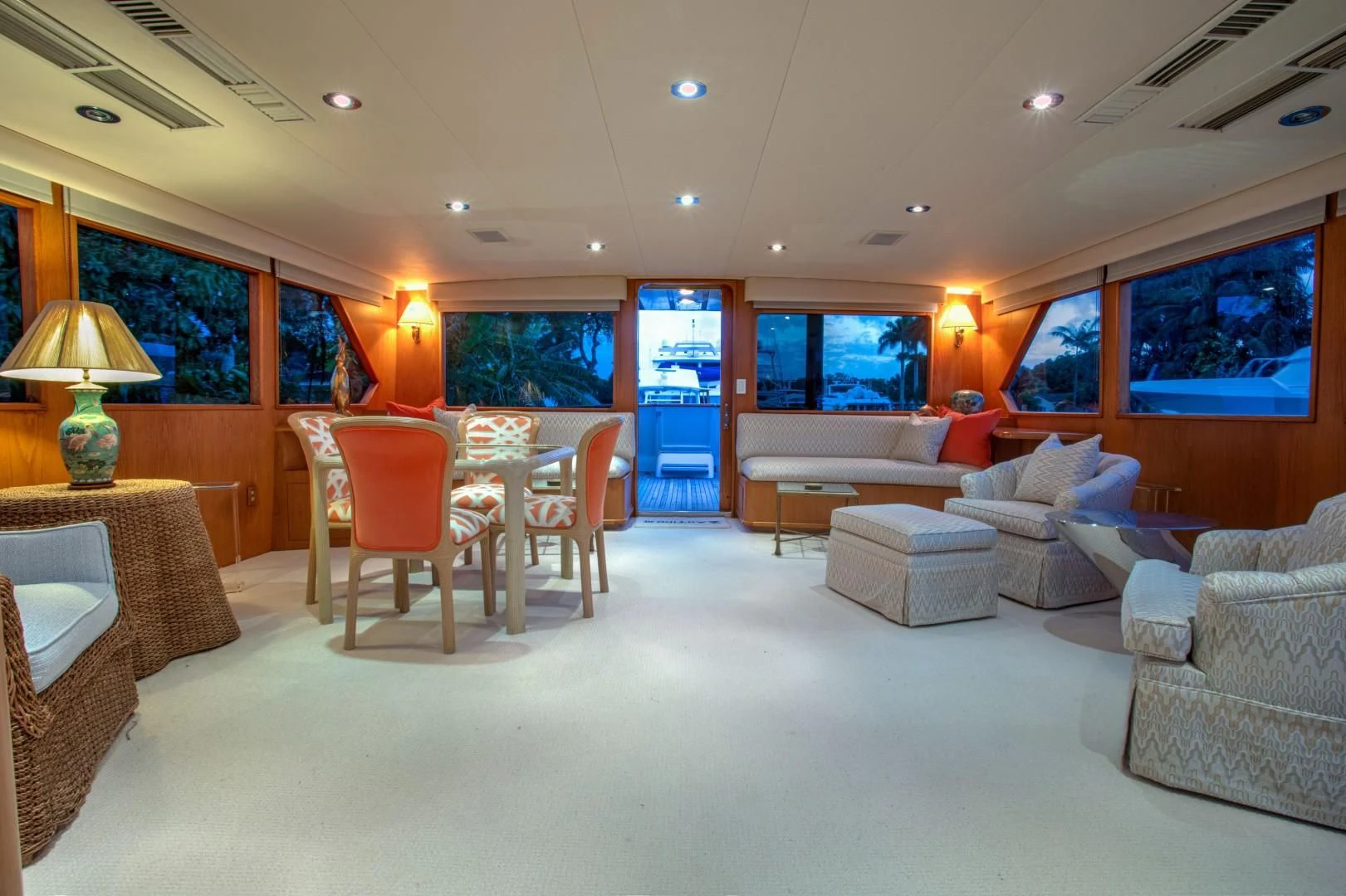 a living room with a table and chairs aboard ZANTINO III Yacht for Sale