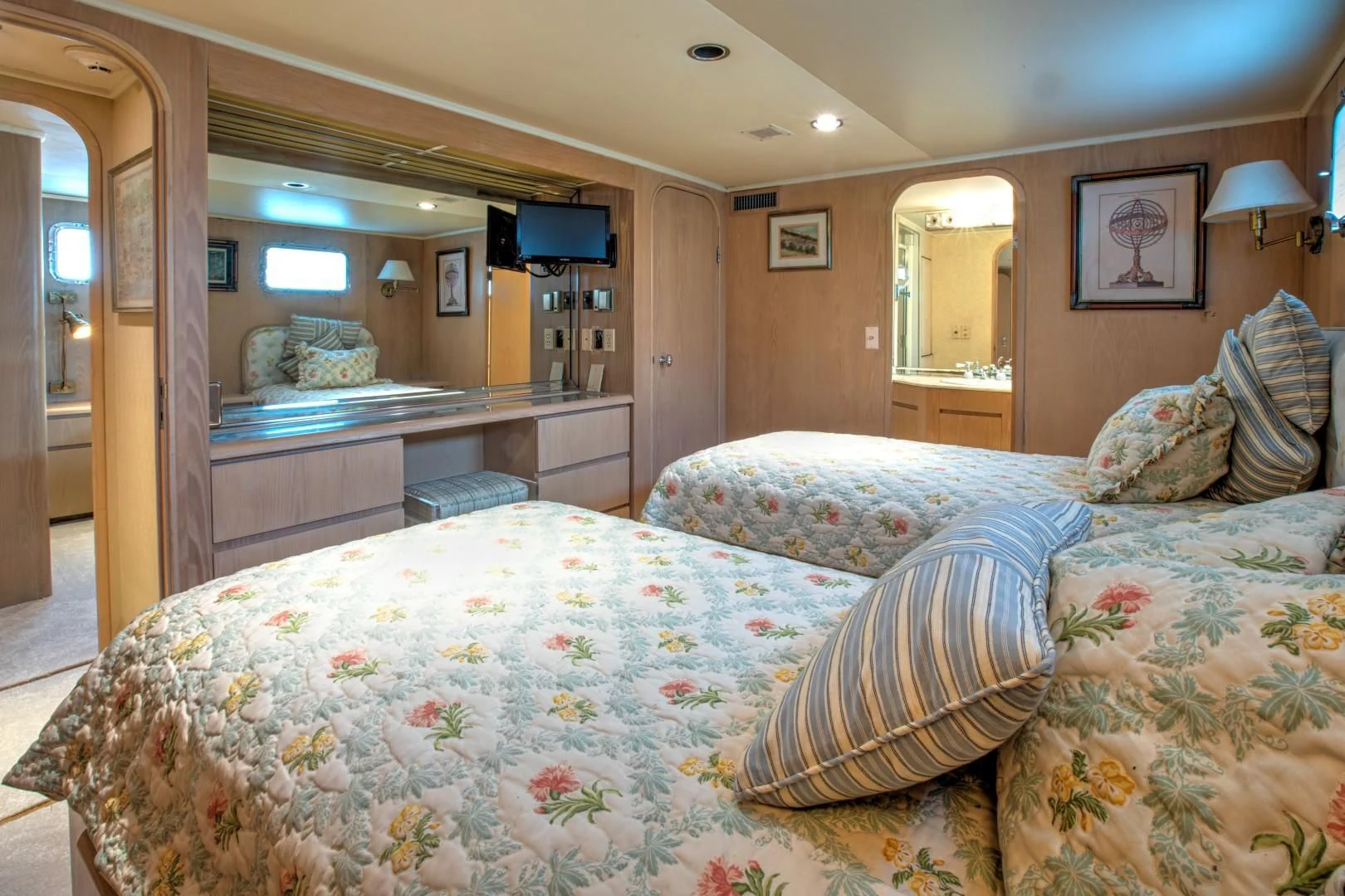 a bedroom with two beds aboard ZANTINO III Yacht for Sale