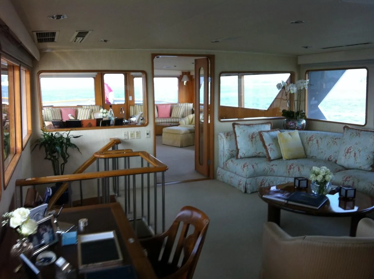 a living room with a couch and a table aboard ZANTINO III Yacht for Sale