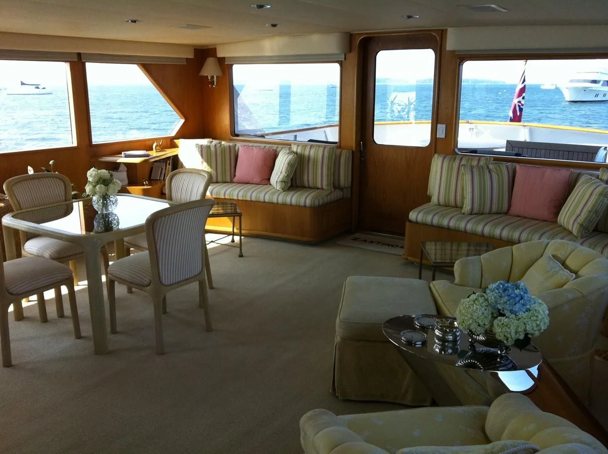a living room with a couch and a table aboard ZANTINO III Yacht for Sale
