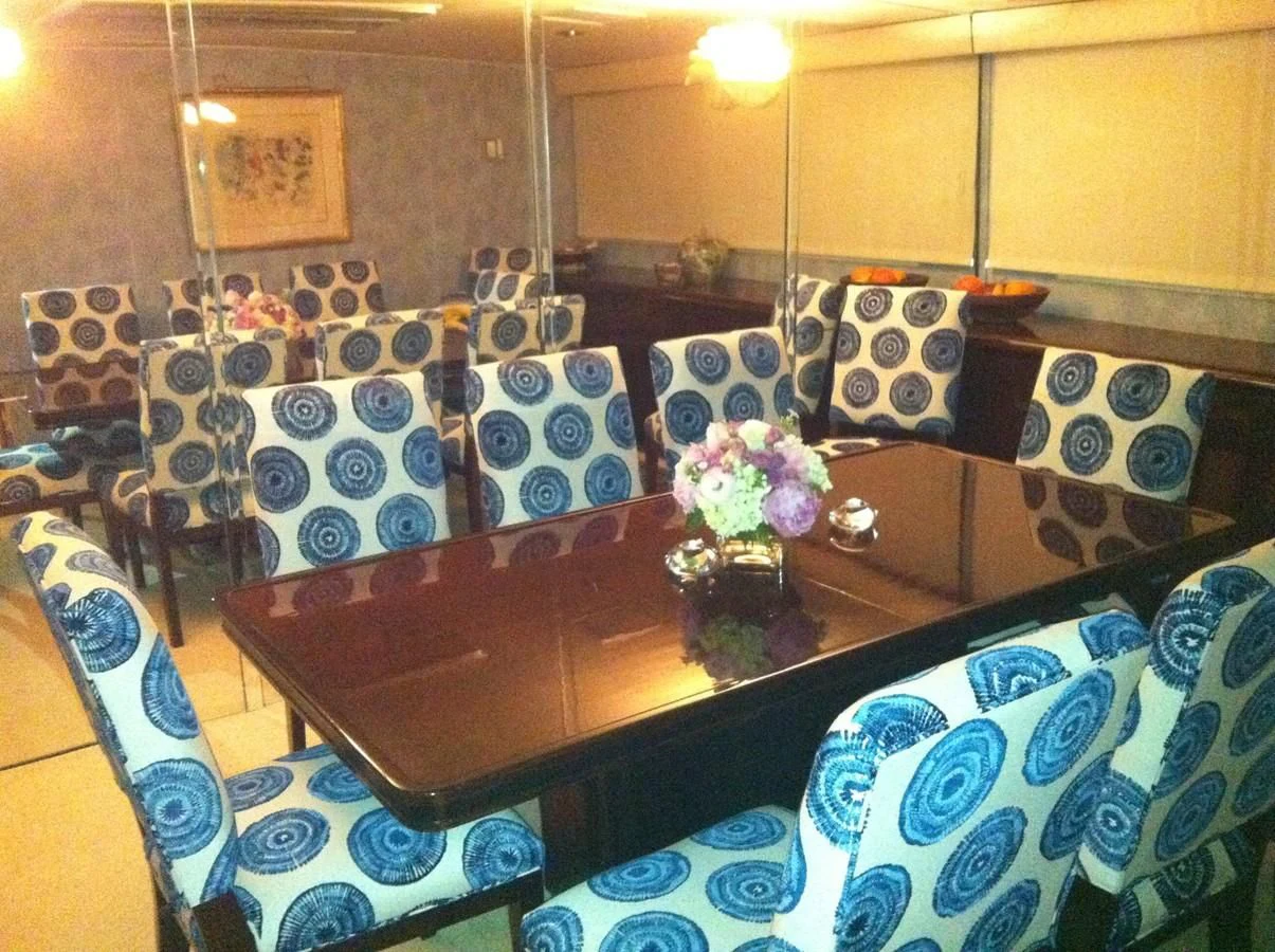 a room with a table and chairs aboard ZANTINO III Yacht for Sale