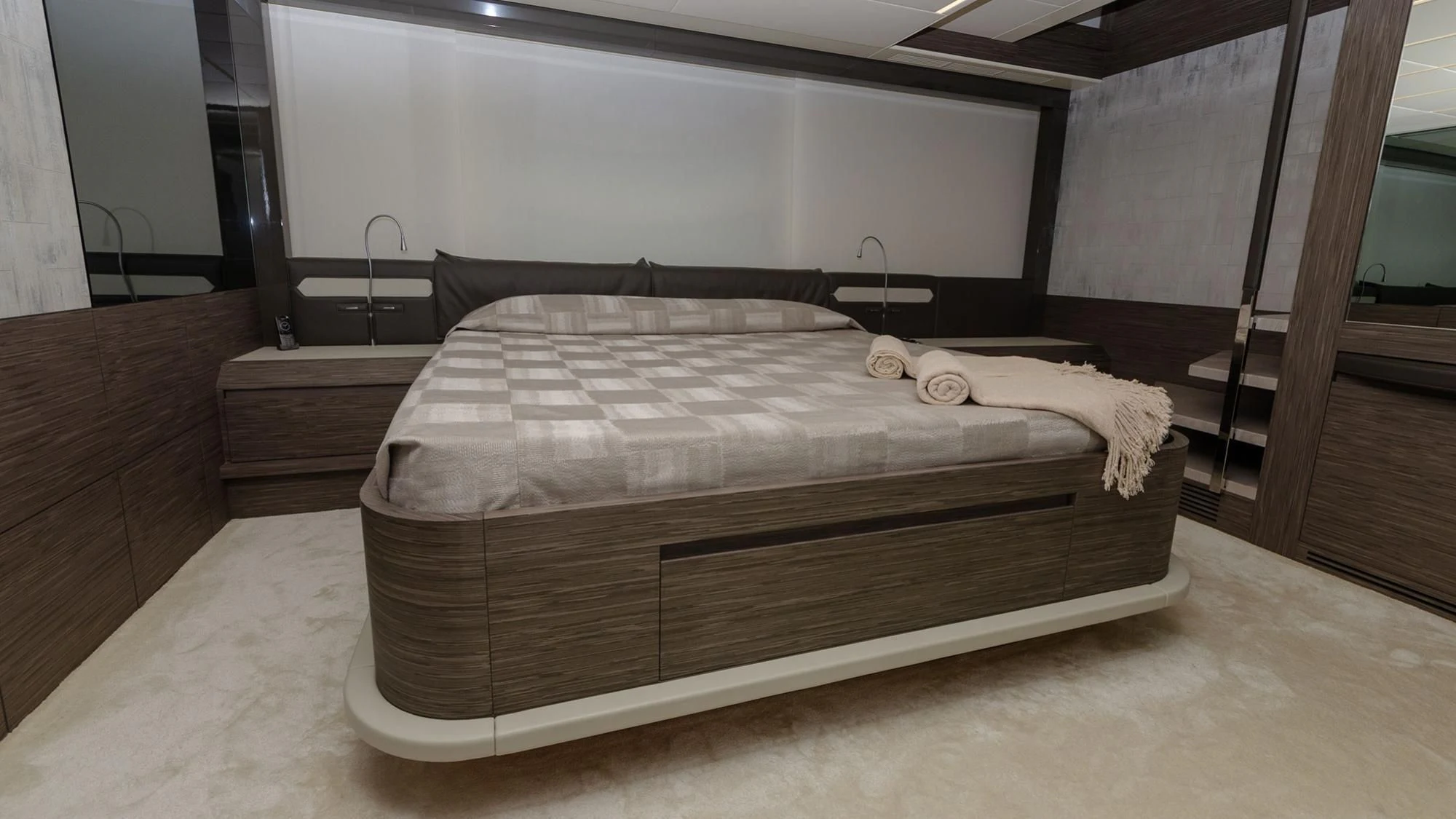 a bed with a wooden frame aboard BAGHEERA Yacht for Sale