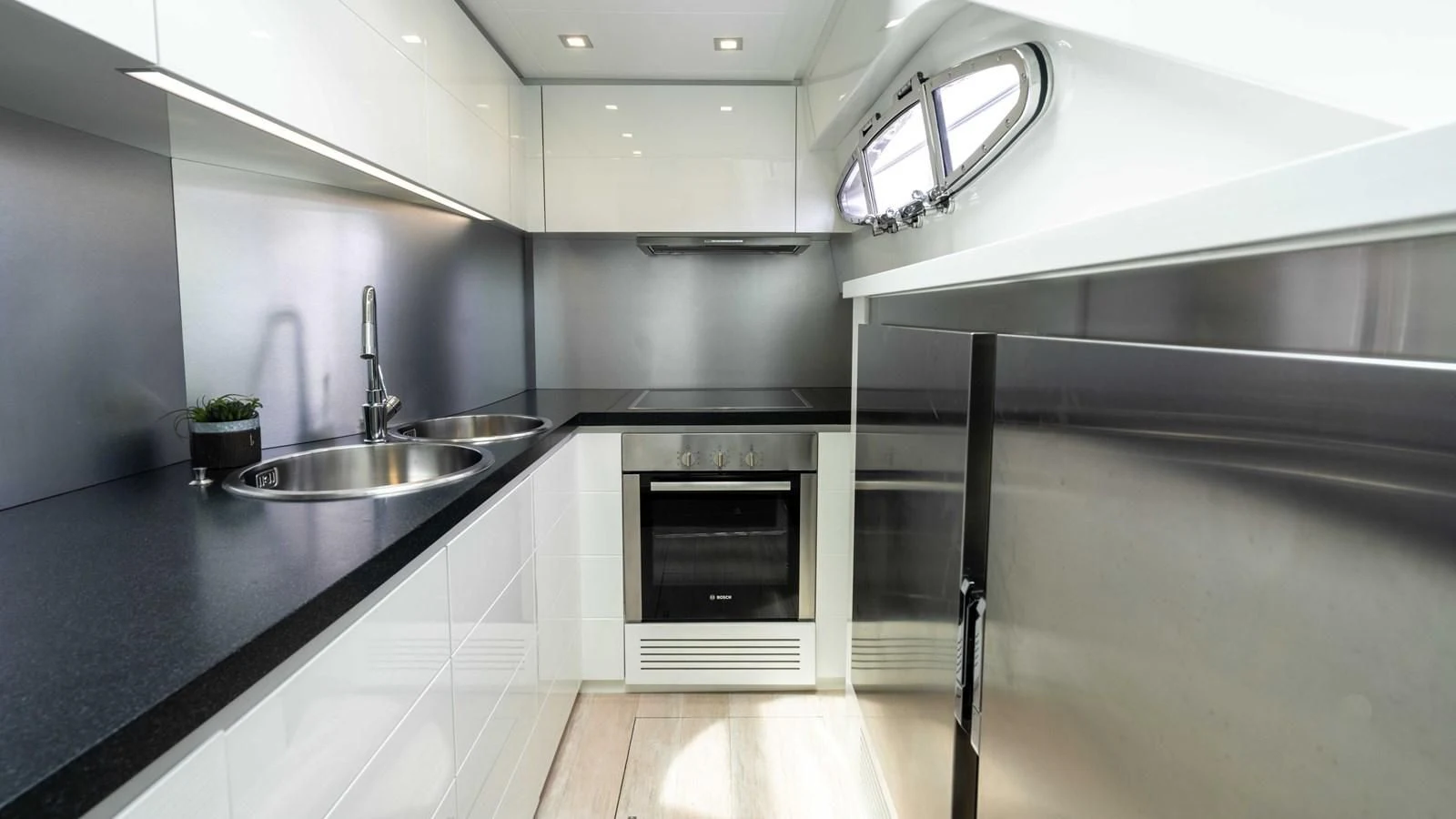 a kitchen with a sink and stove aboard UPTOWN GIRL Yacht for Sale