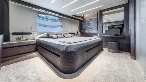 a large bedroom with a large bed aboard UPTOWN GIRL Yacht for Sale