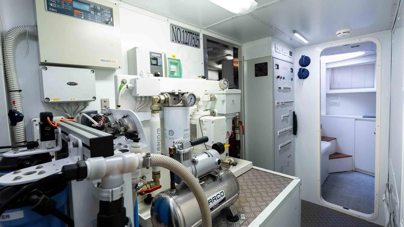 a machine in a room aboard UPTOWN GIRL Yacht for Sale