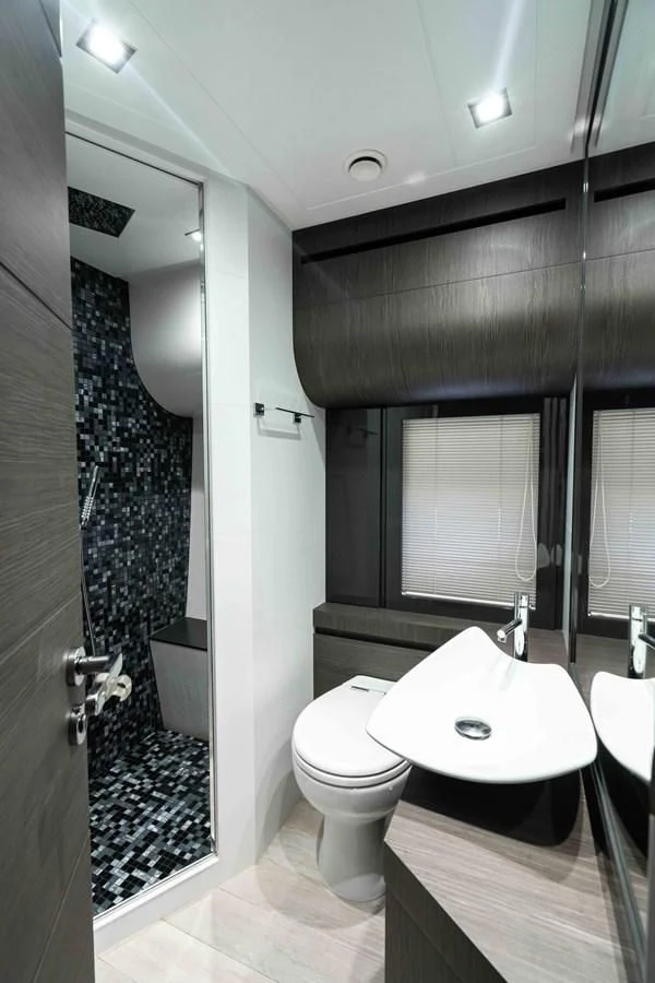 a bathroom with a glass shower aboard UPTOWN GIRL Yacht for Sale