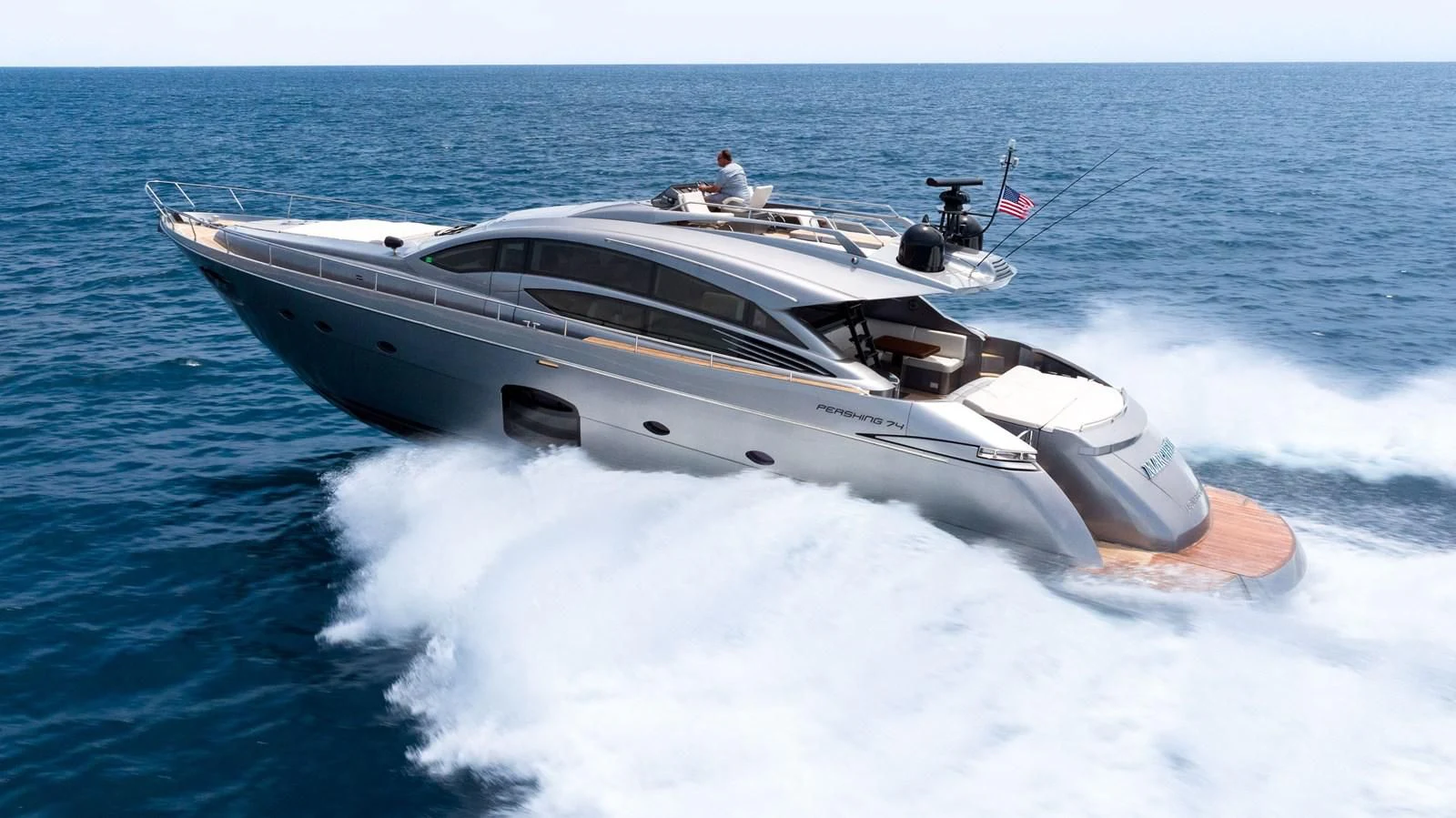 a white yacht on the water aboard UPTOWN GIRL Yacht for Sale