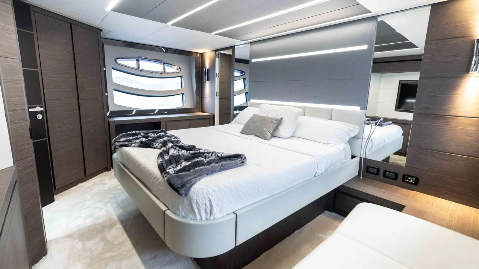 a room with a bed and a window aboard UPTOWN GIRL Yacht for Sale
