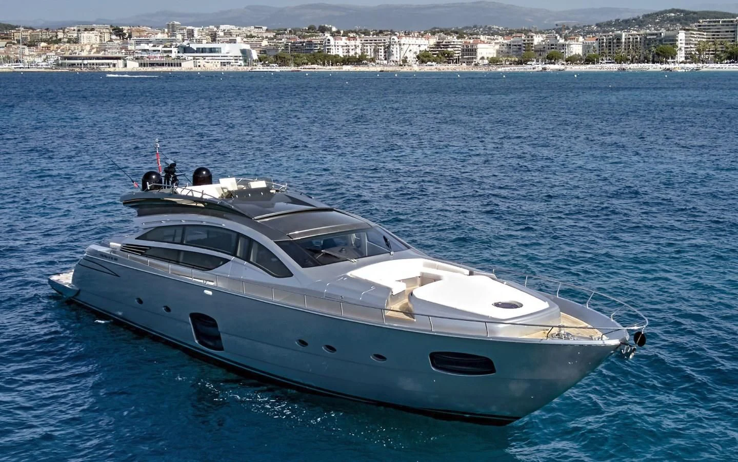 a white yacht in the water aboard UPTOWN GIRL Yacht for Sale