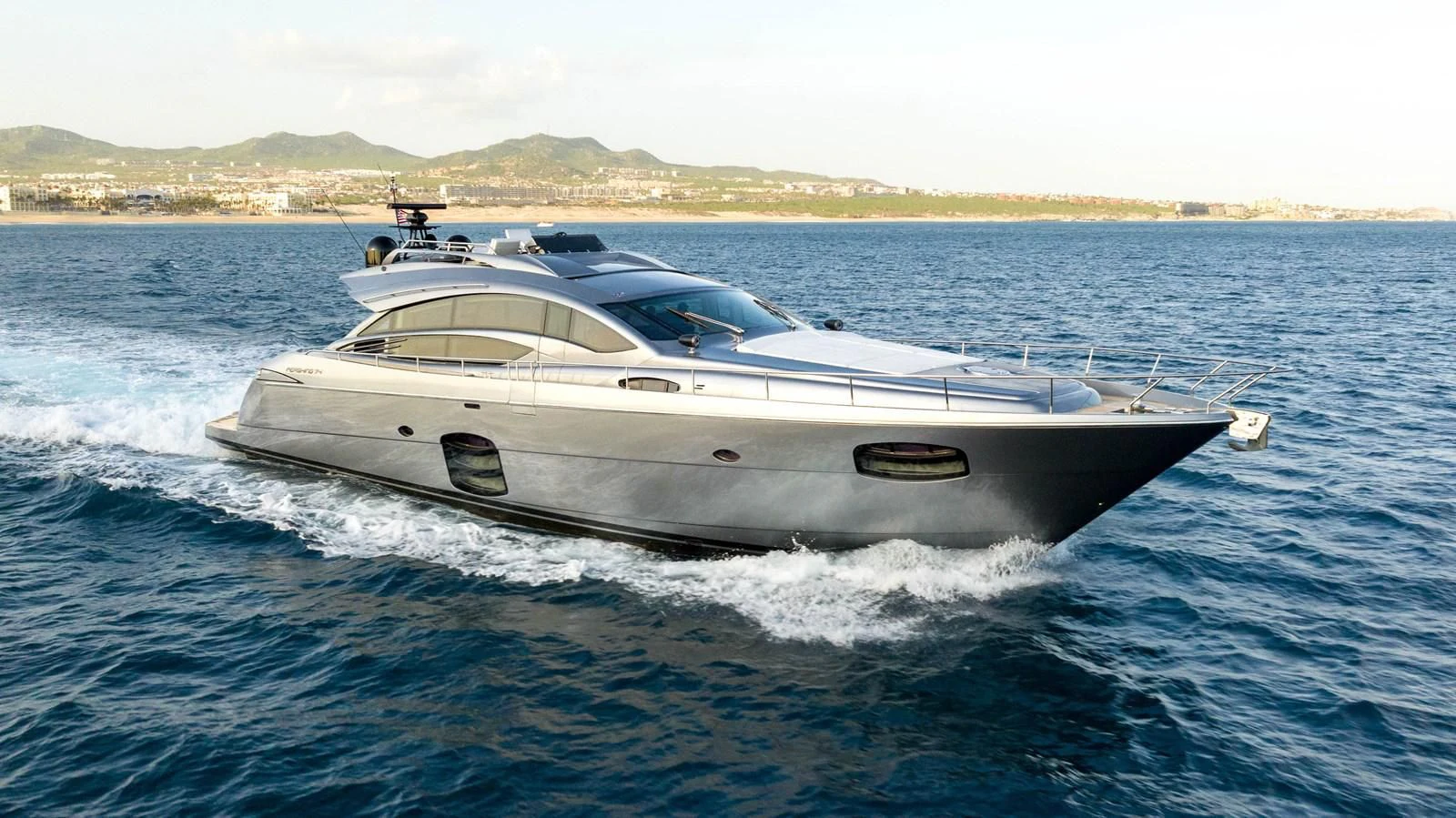 a white yacht on the water aboard UPTOWN GIRL Yacht for Sale