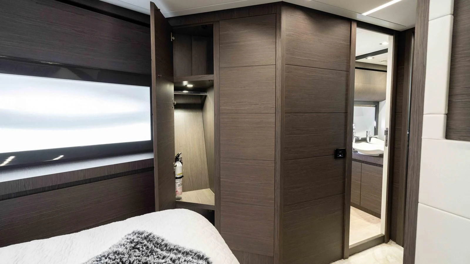 a room with a bed and a closet aboard UPTOWN GIRL Yacht for Sale