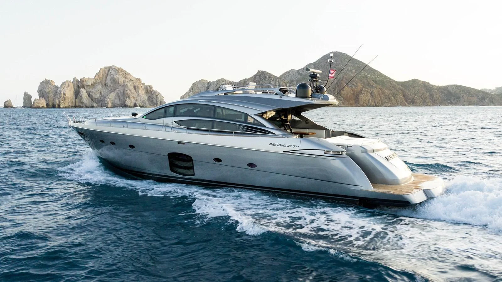 a white yacht on the water aboard UPTOWN GIRL Yacht for Sale