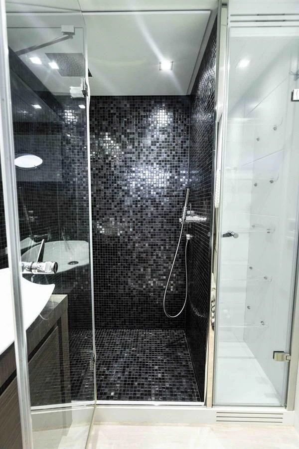 a shower unit with a mirror aboard UPTOWN GIRL Yacht for Sale