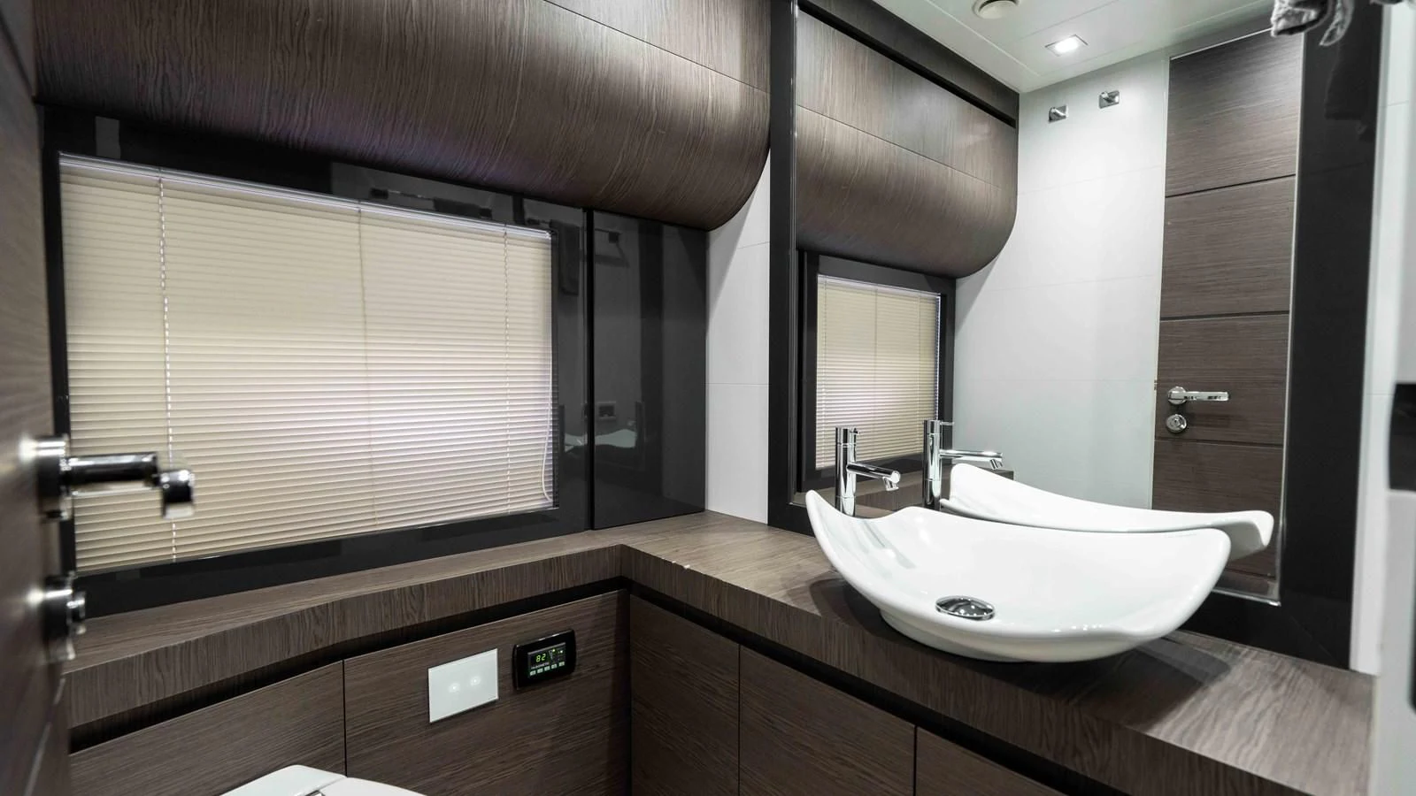 a bathroom with a sink and a mirror aboard UPTOWN GIRL Yacht for Sale