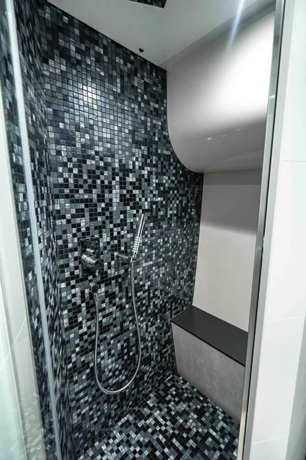 a shower with a shower curtain aboard UPTOWN GIRL Yacht for Sale