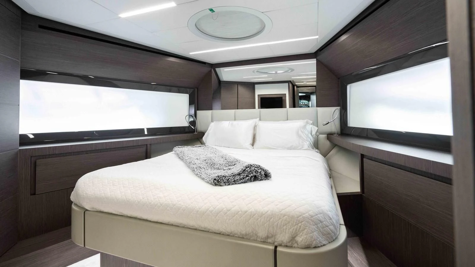 a room with a bed and a television aboard UPTOWN GIRL Yacht for Sale