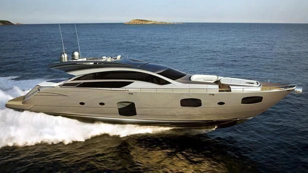 a white yacht on the water aboard UPTOWN GIRL Yacht for Sale