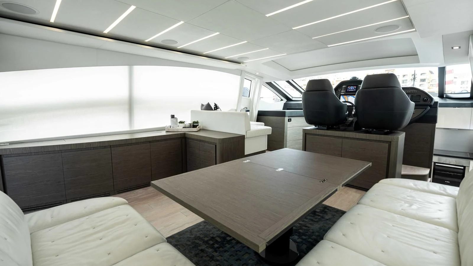 a room with a table and chairs aboard UPTOWN GIRL Yacht for Sale