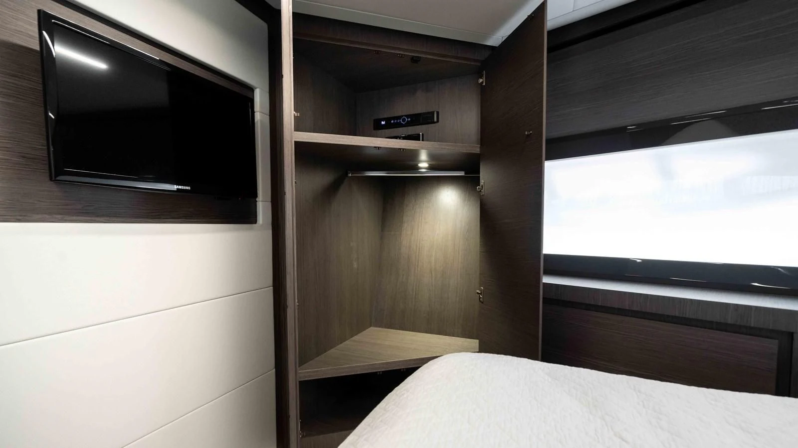 a room with a bed and a television aboard UPTOWN GIRL Yacht for Sale
