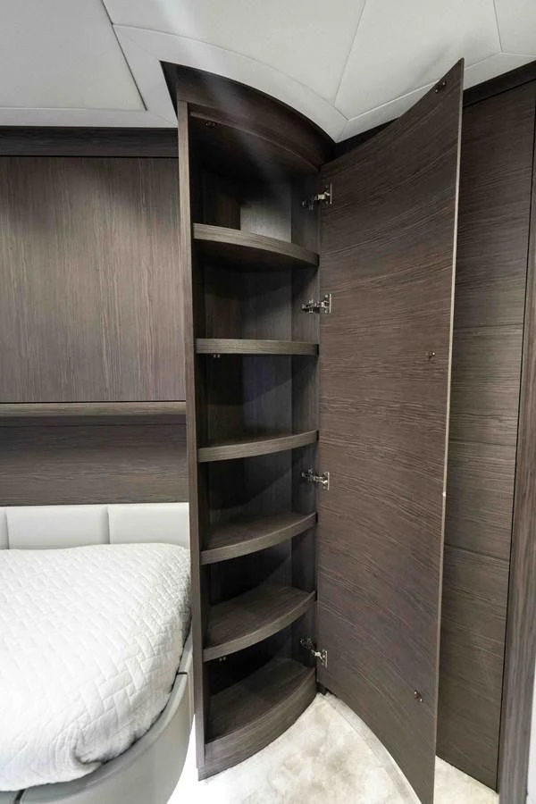 a room with a bed and a closet aboard UPTOWN GIRL Yacht for Sale