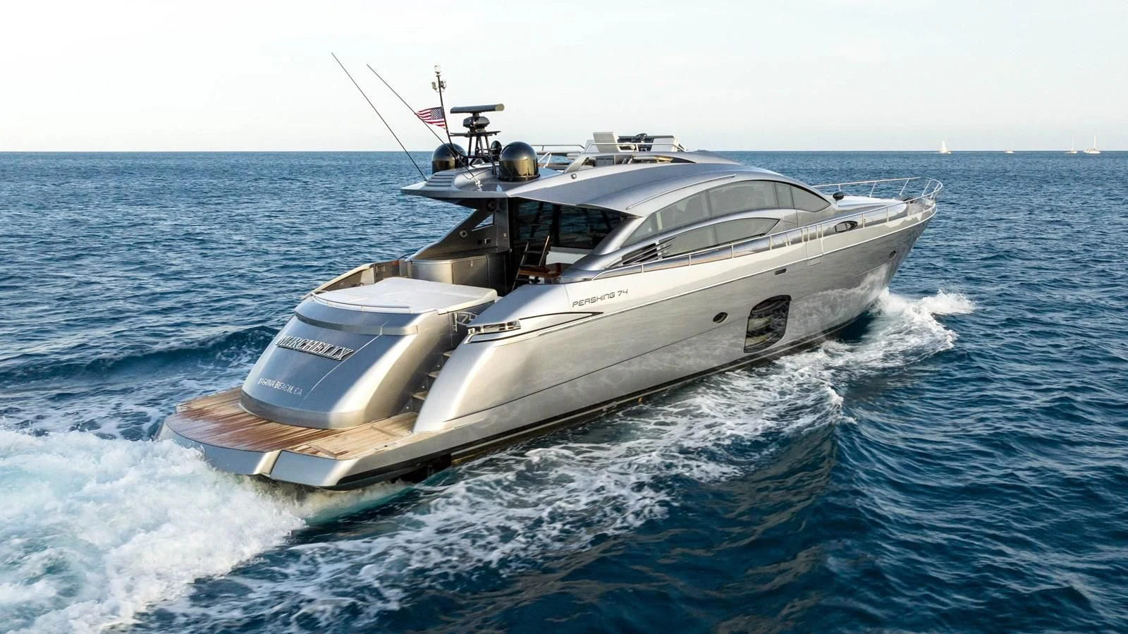a white yacht on the water aboard UPTOWN GIRL Yacht for Sale