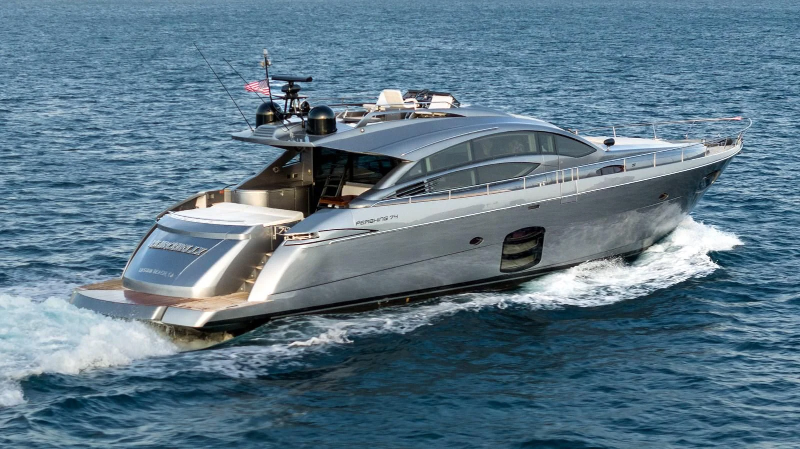 a white yacht on the water aboard UPTOWN GIRL Yacht for Sale