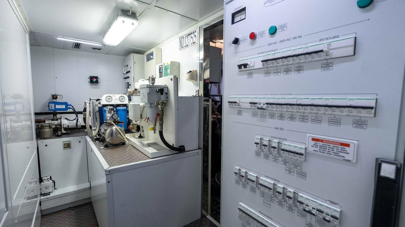 a white machine with a white board aboard UPTOWN GIRL Yacht for Sale