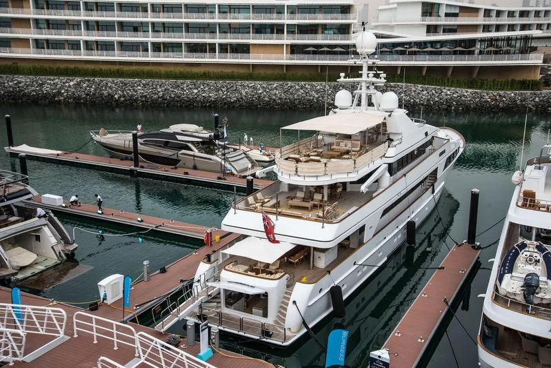 a large boat docked at a pier aboard MYSORAH Yacht for Sale