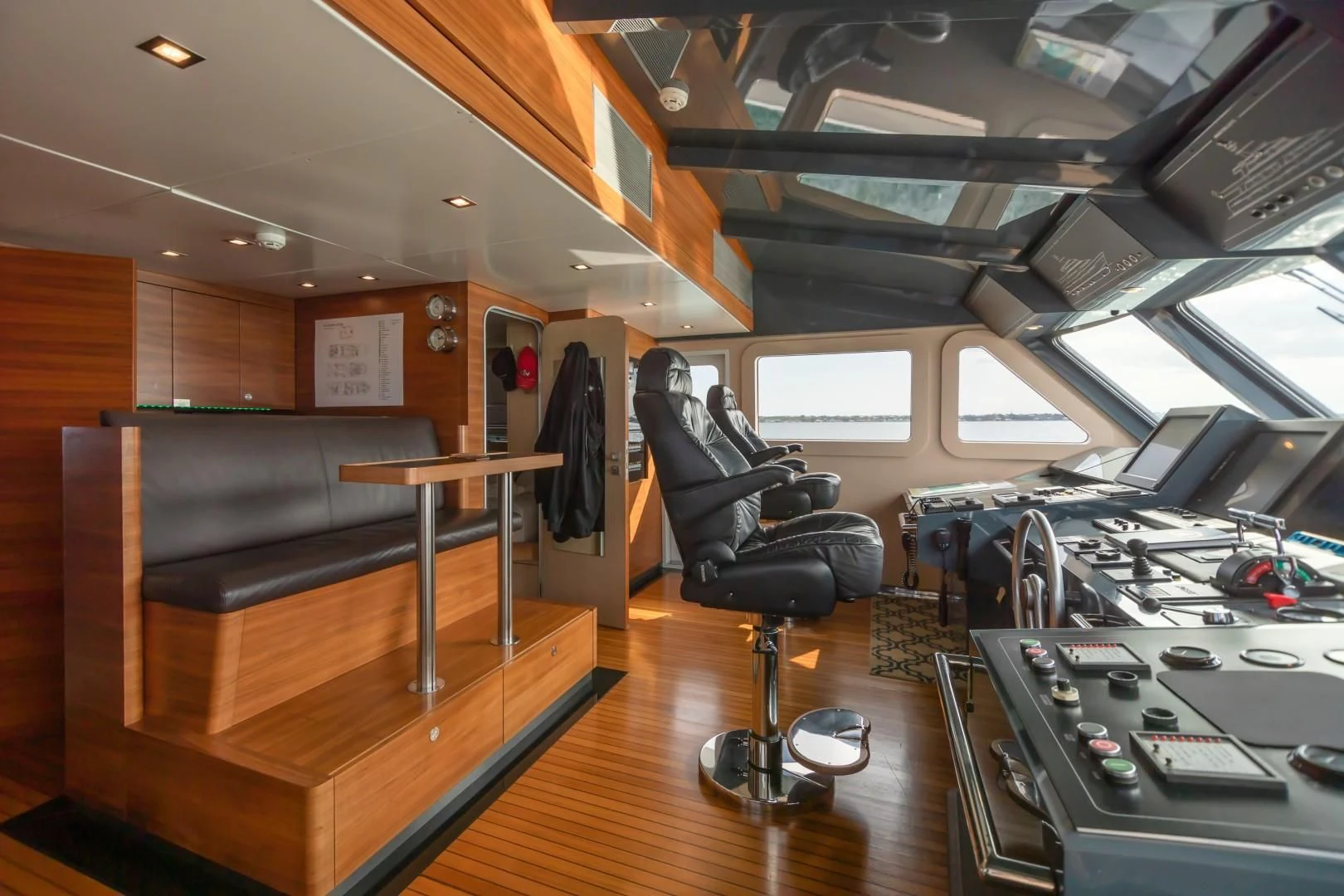 a room with a chair and a table with a machine on it aboard SEA AXIS Yacht for Charter