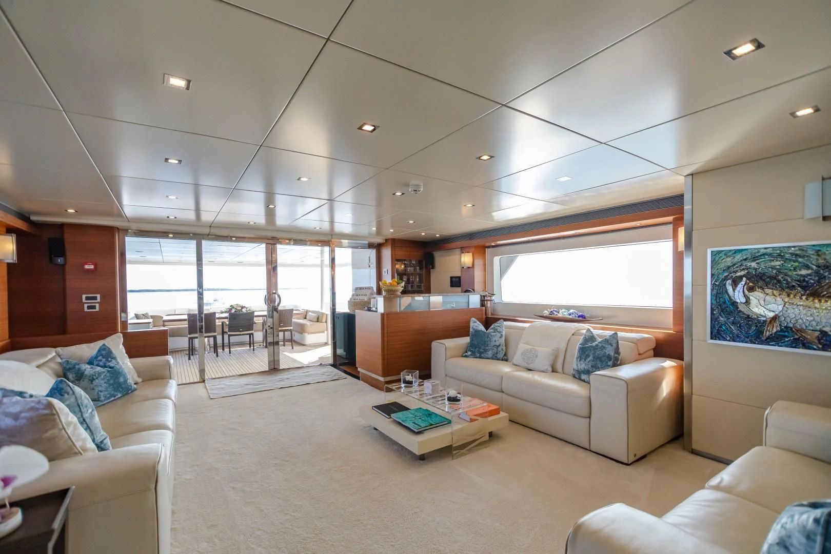 a living room with a large window aboard SEA AXIS Yacht for Charter