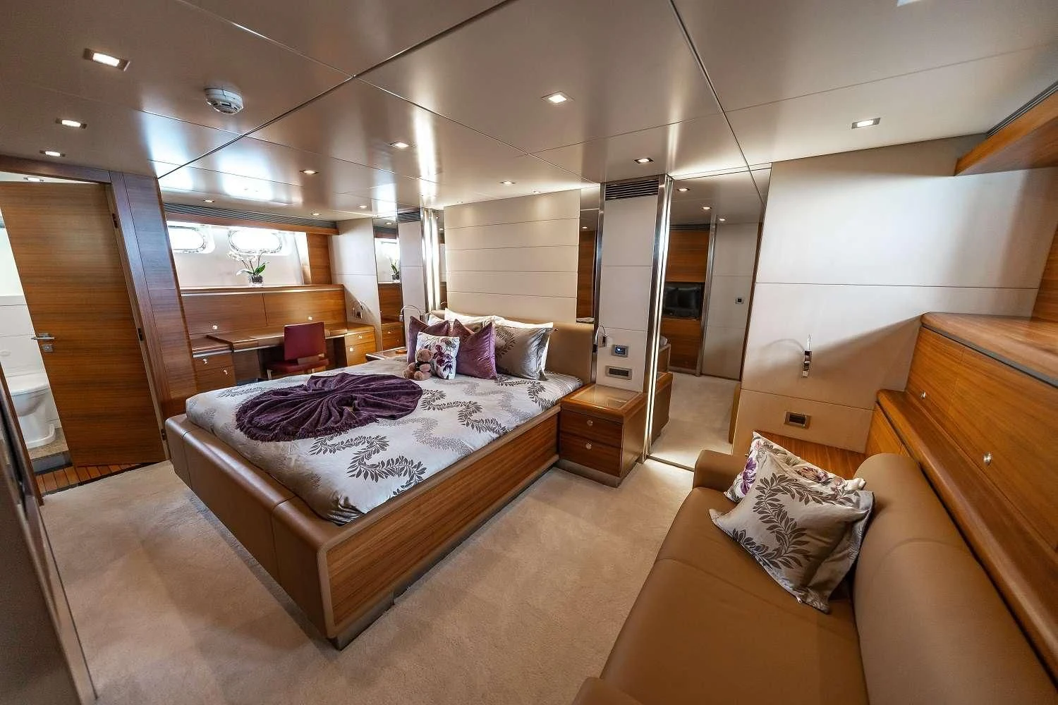 a large bedroom with a large bed aboard SEA AXIS Yacht for Charter